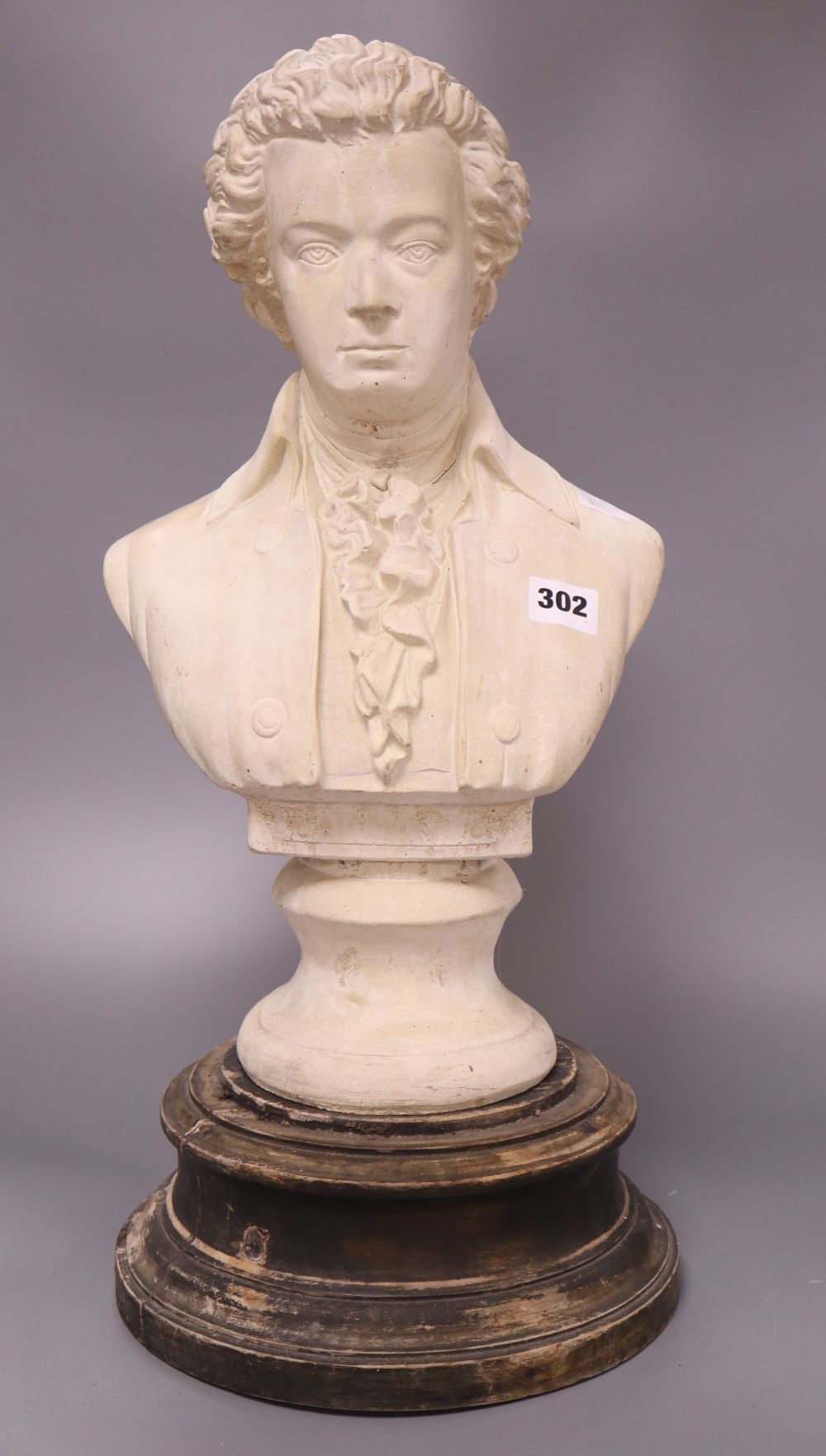 A reconstituted bust of Mozart, height 44cm excl. stand